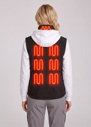 Back view of female model wearing black softshell heated gilet, red glowing heating zones on collar and back, studio light grey background, ladies sleeveless electric warming vest.