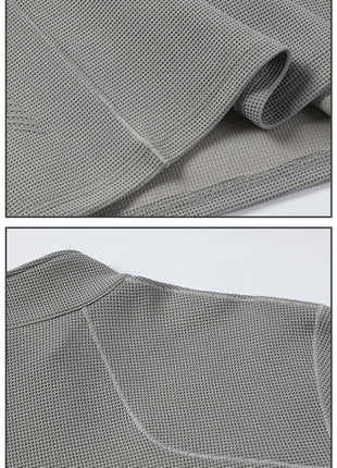 back stitching and hem design of waffle knit half zip activewear pullover